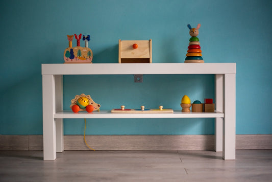 A white table with toys on top of it
