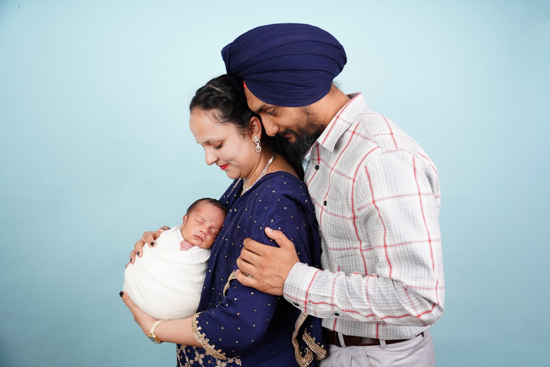 Parents holding their newborn baby with love