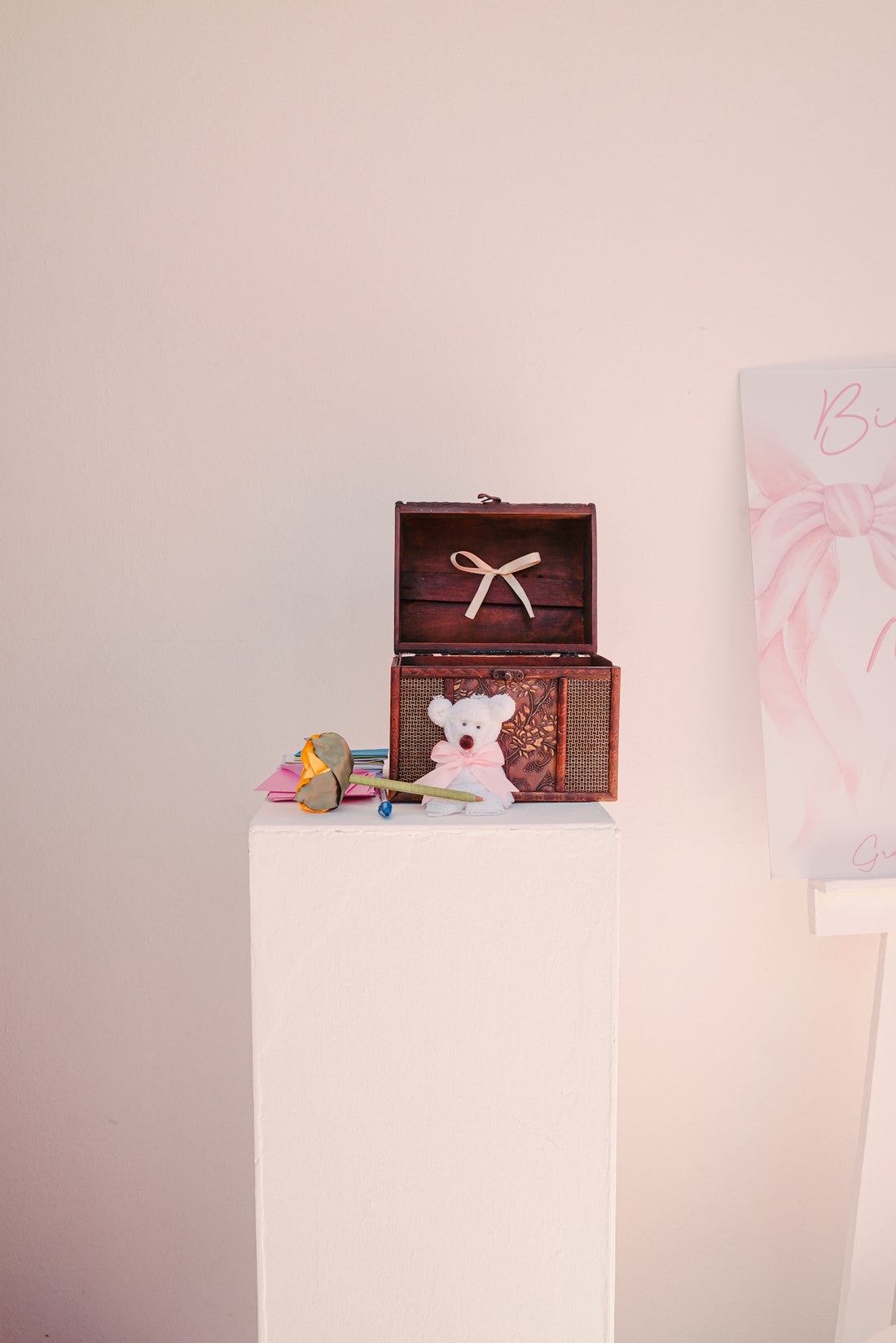 Open treasure chest with teddy bear and gifts