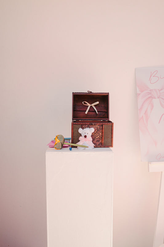 Open treasure chest with teddy bear and gifts